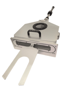 Industrial machine part with handle and slot.