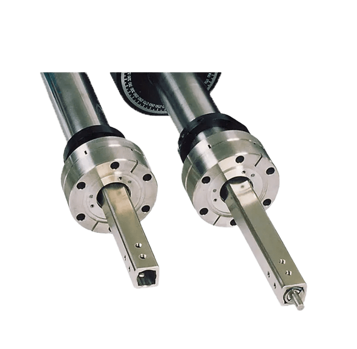 Two metallic industrial tool heads, black background.