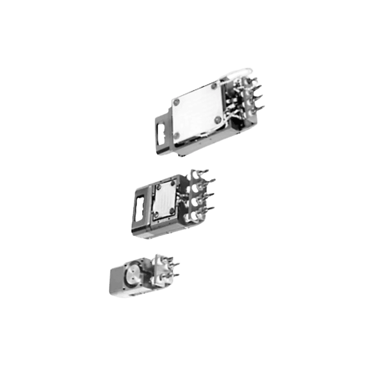 Three metallic electronic components on black background.